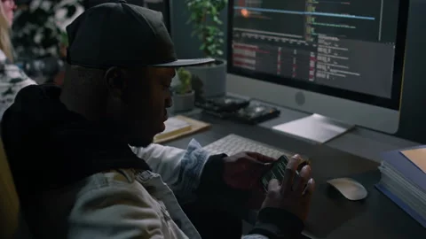African American Male Programmer Testing his Code on Mobile Gadget Stock Footage 273832689