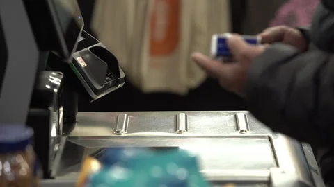 African american man checking out grocery store items at self checkout Stock Footage 309293900