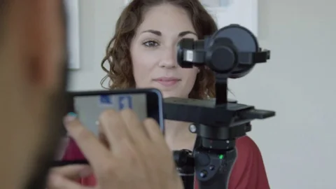 African American Man Controlling Robot With Touchscreen With Engineering Partner Stock Footage