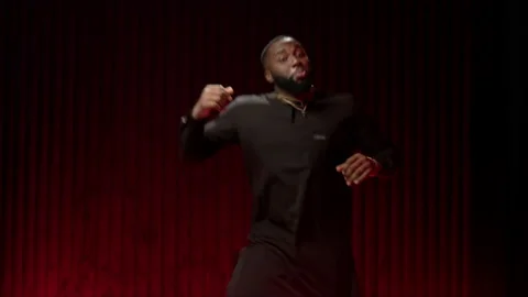 African American man dancing in the studio in a bright image. Portrait of a Stock-Footage 144616348
