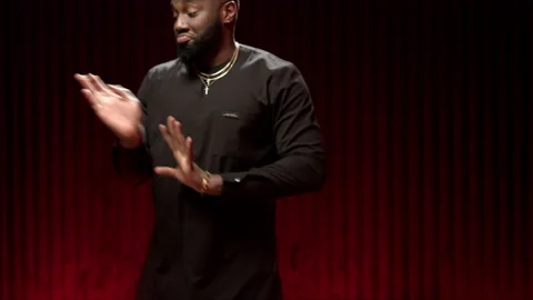 African American man dancing in the studio in a bright image. Portrait of a Stock-Footage 144617468