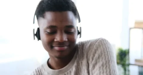 African American man dancing while listening music on headphones Stock Footage 196078898