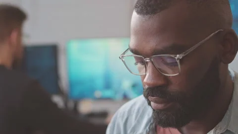 African American Man Developing Video Game in Office Video stock 224057904