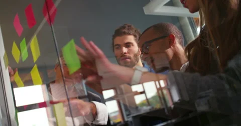 African-american man explaining brainstorming to business team in startup office Stock Footage 61141949