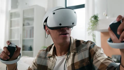 African American man exploring virtual reality experience at home 3d video game Stock Footage 244525713