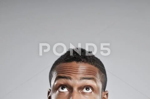 African american man eyes only looking up Stock Photos