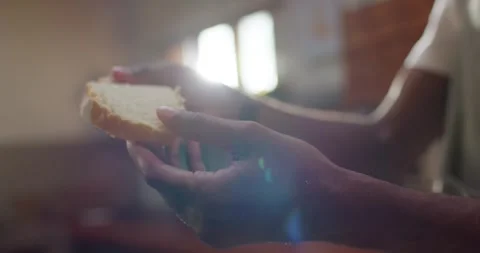 African American man inspecting bread, steam rising, tearing crumb and testing Stock Footage 336658827