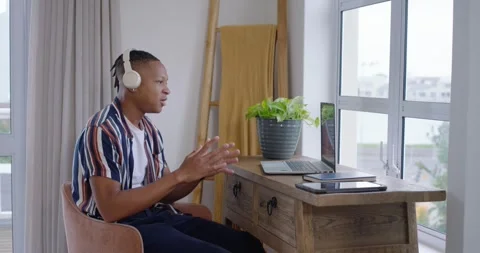 African American man joining call, speaking, clapping, gesturing at home office Stock Footage 342844373