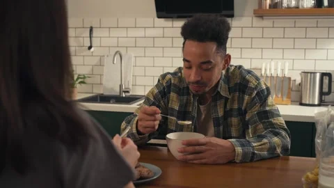 African-American man in a kitchen while talking to a girl. Stock Footage 305652150