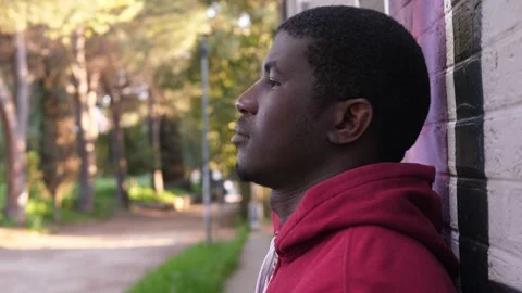 African American man looking down feeling broken by past mistakes Stock Footage 332419126