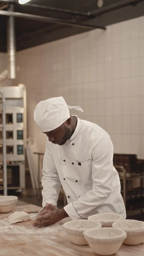 African American Man Making Bread in Bakery Shop Stock Footage 259859916