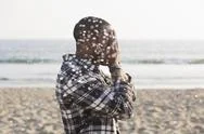 African American Man Playing On Beach Stock Photos