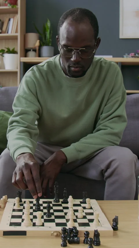 African American Man Playing Chess with Himself at Home Stock Footage 291831895