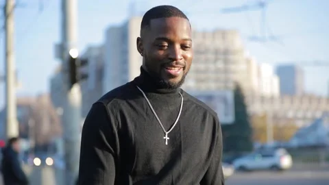 African-American man posing for camera in city Stock Footage 143574859