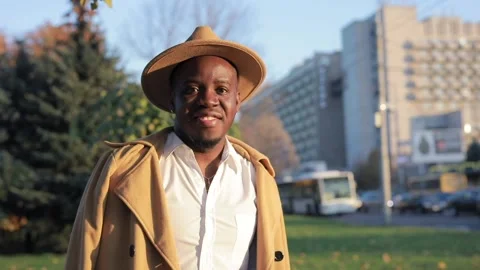African-American man posing for camera in city Video stock 143575348