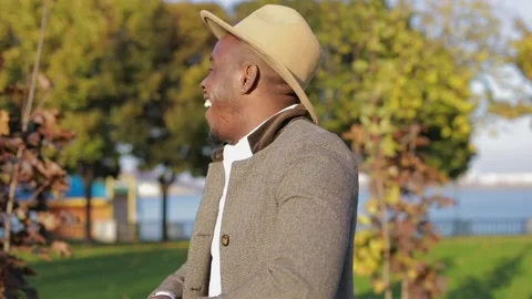 African-American man posing for camera in the park Stock Footage 147952833