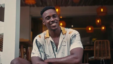 African-American man smiles while standing in a coffee shop Stock-Footage 158143136