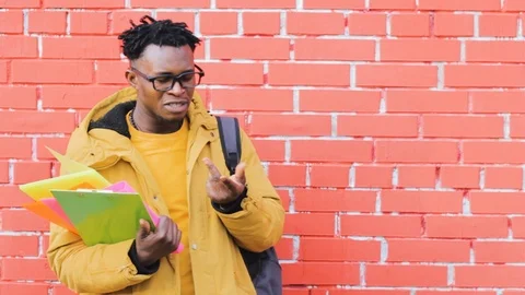 African American man trying complex decides chooses offers options 스톡 동영상 123535744