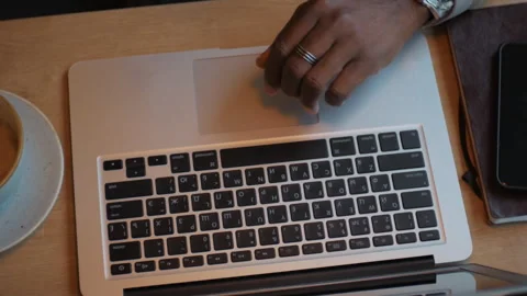 African American man typing text on laptop. Works in the office. Close up. Stock Footage 262629488