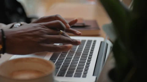African American man typing text on laptop. Works in the office. Close up. Stock Footage 268986970