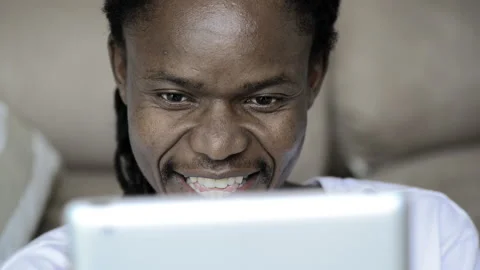 African American man using and viewing tablet computer Stock Footage 199628863