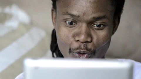 African American man using and viewing tablet computer Stock Footage 199628909