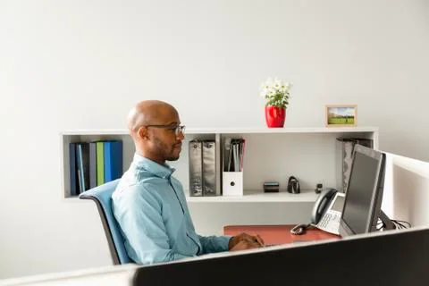 African American man using computer in office Stock Photos