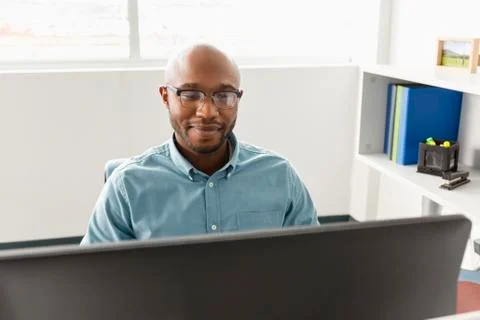 African American man using computer in office 스톡 사진