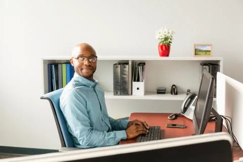 African American man using computer in office Stock Photos