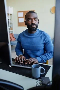 African American Man Using Computer For Programming 스톡 사진