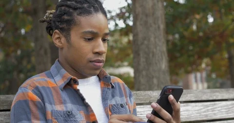 African American Man Using Smart Phone Video stock 121388782