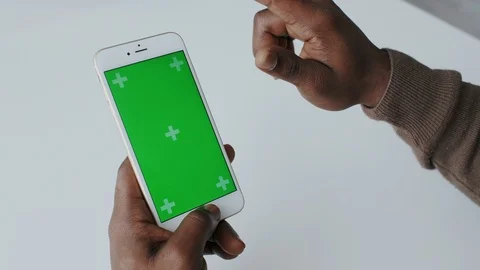 African American Man Using Smartphone with Green Screen or Mockup Tracking Stock Footage 120679946
