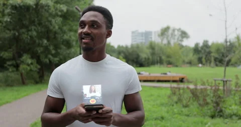 African american man using smartphone in chat dating app browsing internet Stock Footage 228785629