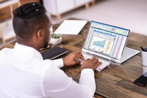 African American Man Using Spreadsheet Reports Stock Photos