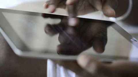 African American man using tablet computer for information. Stock Footage 199628735