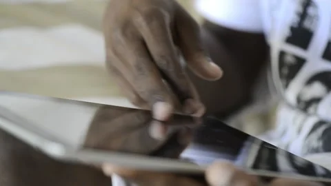 African American man using tablet computer for information. Видео 199628747