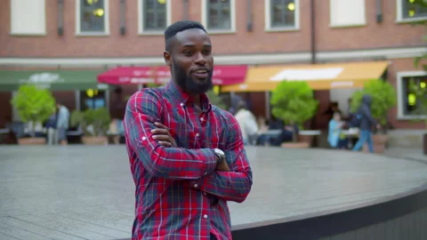 African-American man wait for date in city. Realtime Stock Footage 227192143