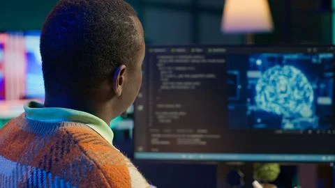 African american man working on computer to write code and programming 写真素材