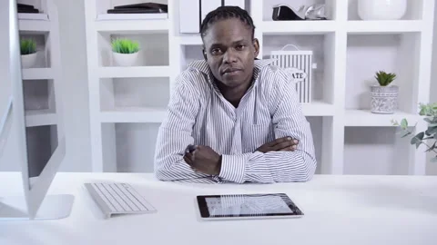 African american man working on tablet computer in home office Stockbeeldmateriaal 199629823