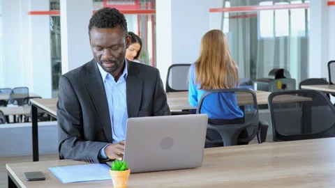African american manager holding folder with documents works in open space Stock Footage 123964009