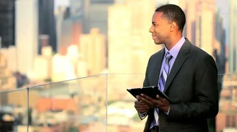 African American manager planning investment banking using tablet on rooftop Stock Footage
