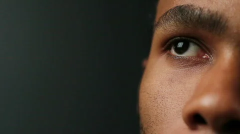 African American man's eyes, looking up Stock Footage