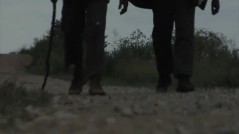 African-American Men walking down dirt road - 19th Century Slavery Portrayal Stock Footage 150633697