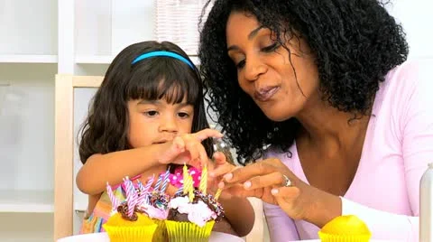 African American Mother Child Decorating Cupcakes Close Up Stock Footage