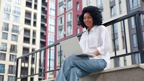 African American Office Worker Using Laptop Computer, Online Learning Seminar. Stock Footage 249825951