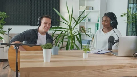 African American Presenter is Broadcasting Live. An Influential Musician Sings Stock Footage 163532080