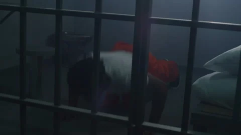 African American prisoner does push-ups Stock Footage 246954905