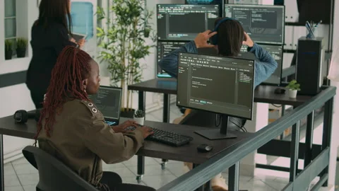 African american programer typing source code on computer Stock Footage 217408219