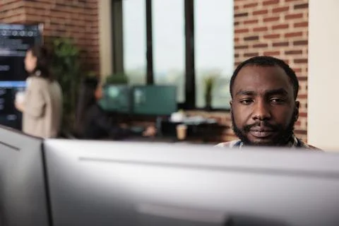African american programmer developing high security application with multiple Stock Photos