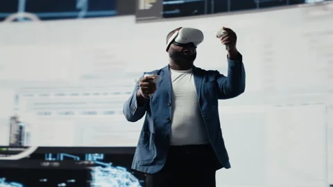 African American programmer engaging in virtual reality with a headset Stock Footage 312302701